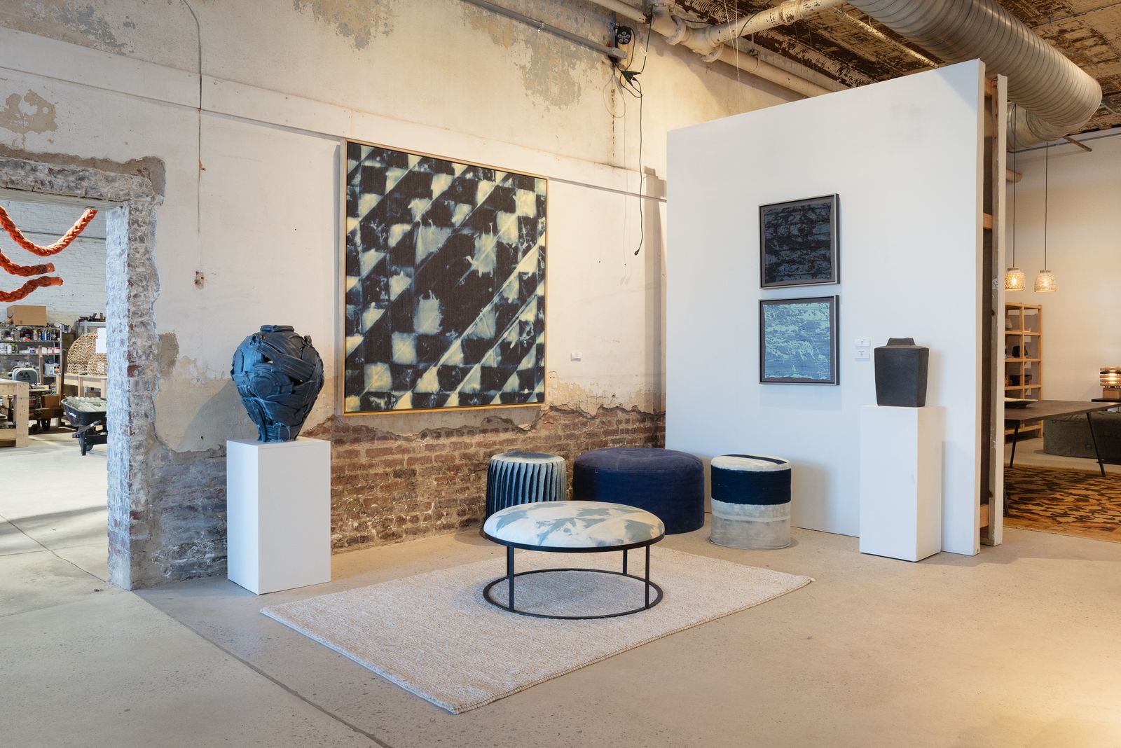 Showroom corner with artwork and brick
